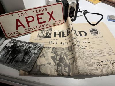 The Western Wake Herald (aka Apex Herald) has figured prominently in all the major events of the town of Apex, North Carolina. This display contains artifacts from the town’s centennial 50 years ago.