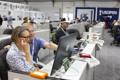 Pilot creative director Andie Rose and publisher David Woronoff consult in the U.S. Open Golf Championship media tent while editor John Nagy works on copy. (The Pilot)