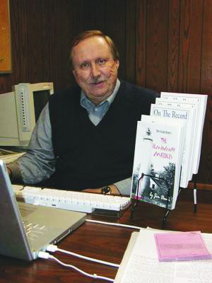 Iosco County News-Herald and Oscoda (Michigan) Press Former Publisher Jim Dunn pictured with a few volumes of his various literary projects. The journalist, who worked for more than 40 years in Iosco County, recently passed away.