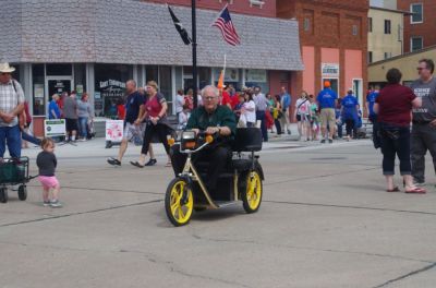 Bill Blauvelt cruises for news in his three-wheeler on the streets of downtown Superior.