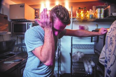 Mike Howell, owner of Howell’s Sandwich Co., tears up as he closes his shop to the public on March 20. Restaurants and shops like Howell’s have had to shut their doors and lay off employees to stop the spread of the coronavirus. Doing their part to help prevent the public health crisis comes with a price for local business owners who don’t know how they will survive financially. (Lloyd Mullen | Port Townsend (Washington) and Jefferson County Leader)