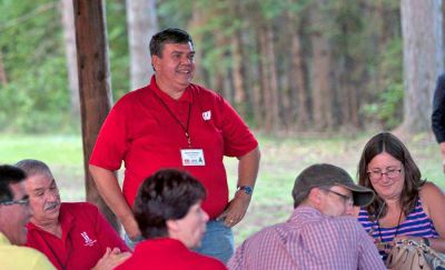 Brian Thomsen speaks to a group at the Friday Night Steak Fry on Aug. 19, 2016, during the WNA Trees Retreat in Eagle River. (Photo by Photo by Julia Hunter, WNA)