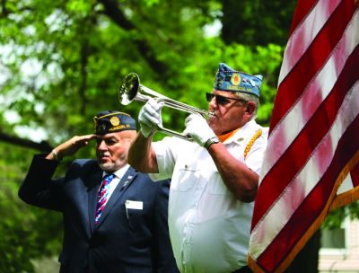 Rollie Fink performs “Taps” during the American Legion Post 157’s Memorial Day ceremony at Kiwanis Park in the City of Horicon. Also pictured is Jim Kell. [Mitchell B. Keller | Dodge County Pionier (Theresa, Wisconsin)]