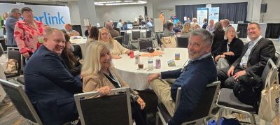 NNA Treasurer Jeremy Gulban (right), CEO, CherryRoad Technologies, Parsippany, New Jersey, poses for a photo with attendees after presenting the flash session, Digital Printing Solution for Small Press Runs. CherryRoad has developed a printing solution ideal for short runs under 1,500 copies and for remote locations.  Using high performance Xerox printers to print tabloid newspapers, staff have rolled this out to approximately 30 of its 95 markets.